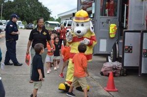 Sparky the Fire Dog greeting children
